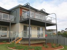  Bermagui   NSW   2546 Seaside living in the lovely village of Bermagui. This three bedroom townhouse is located right opposite an eco-wonderland beach reserve.  Be enthralled by the swans and birdlife on the natural lagoon opposite, or the breakers rolling in to the beach.  This townhouse offers stunning ocean and beach views to the north east.  The fully tiled first floor, accommodates the main living area opening to a front balcony, kitchen and guest toilet with hand basin and the double garage under the roofline which is at street level on the rear.  The carpeted ground floor has 3 bedrooms, main and ensuite bathrooms, laundry and a covered deck.  Affordable luxury and what a location to enjoy Bermagui with an easy bike/walking track to the shops or beach. 