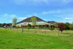  2626 Maroondah Highway Mansfield VIC 3722 129 ACRES MANSFIELD LIFESTYLE FARM Set upon 129 acres of gently undulating grazing country, this superb lifestyle farm awaits. The solid brick homestead is set amidst beautifully landscaped gardens to capture picturesque rural views from its wide and shady return verandahs. Immaculately presented throughout, the home comprises 4 generous bedrooms and 2 bathrooms. Master bedroom with ensuite and WIR. The fully equipped modern kitchen features quality, stainless appliances plus the latest new generation combustion stove, dishwasher & butlers-walk in pantry. Spacious, combined dining and family living and a huge formal lounge and recreation room provide space for every member of the family in this grand lifestyle home.  Outside, a large undercover entertaining area features a huge open fireplace for atmospheric evenings with friends and family whilst theres also a massive 4 car garage under the roofline. Your farming needs are amply catered for with hay shed, feed silo, shearing shed, yards and a solid cattle crush & ramp plus bore with established garden watering system plus 3 massive domestic rain water tanks to provide 28,000, 25,000 & 4,000 gallons each.  General Features Property Type: House Bedrooms: 4 Bathrooms: 2 Land Size: 52.20ha (129.00 acres) (approx) Indoor Features Ensuite: 1 Toilets: 2 Study Workshop Built-in Wardrobes Dishwasher Split-system Heating Split-system Air Conditioning Reverse-cycle Air Conditioning Air Conditioning Outdoor Features Remote Garage Secure Parking Carport Spaces: 2 Garage Spaces: 4 Open Car Spaces: 1 Balcony Outdoor Entertaining Area Shed Fully Fenced Eco Friendly Features Water Tank $1,150,000 
