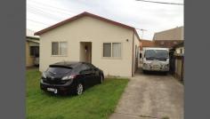 50 Lansdowne St Merrylands NSW 2160 LARGE PROPERTY WITH 2 STREET FRONTAGES: - FACING EDWARD BUGGY ROAD IS: LARGE 370 SQM WAREHOUSE & OFFICE - FACING LANSDOWN STREET IS: 3BR FULLY RENOVATED HOUSE WITH BUILT IS, EN SUITE AND SEPARATE DINING Land size: 1000 SQM Potential Income: $ 1,200 per week