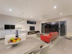  128 N Rd Brighton QLD 4017 Inspections Inspections by appointment only. Builder is offering to dress the all the windows at your choosing, valued at $5,000. Come and see the combination of quality, details and it's elevated position that gets the best of the sea breezes makes it hard to pass by. It comes with everything that a quality new build has to offer - 6 month defects liability period, 6 year structural guarantee and 6 star energy rating. The builder, Bill Bertwistle, a local builder, who specialises in family homes in the area, has thought through all the details to make this the ideal home family home. This includes special thought to cross ventilation, right through to the most important of mod cons being data cabling throughout the entire house and connections in all rooms and Foxtel access. Ready to move in, this brand new two storey four bedroom home features: Ground Floor:  - open plan lounge, kitchen, dining/entertainment  - European appliances including dishwasher, gas stove top with electric oven  - media room (or fifth/guest bedroom)  - powder room  - internal laundry with external access to the clothes line  - double remote garage with internal entry  - large undercover deck  - neat back yard with high fencing Upper Level:  - four bedrooms, all with built-ins  - main bedroom with contemporary double basin en-suite, walk in robe and balcony  - open plan study nook (ideal for the kids open plan computer area)  - ceiling fans throughout  - gas hot water  - Crimsafe security screens or fly screens on all windows  - security lighting. Light and spacious, this home has crisp white tones which makes it easy for you to personalise to your liking. Only a "hop, skip and a jump" to local schools, 600metres to Brighton Village shops, 850m to waterfront, and close to many parks including the local soccer grounds. One of this areas attractions is it’s easy access to the airport, CBD, and highways to the north and south coasts. There are not many new builds around that is so well crafted, so call Jacqui McKeering from Jim McKeering Real Estate for an immediate inspection. Energy Efficiency Rating: 6.0-star NABERS Energy Rating 