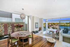  54A Burns Crescent Chiswick NSW 2046 sophisticated offering of unquestionable quality and refinement in a 
blue ribbon harbourside setting, this breathtaking residence is quite 
simply beyond compare. Flowing over three levels and finished to the 
highest of standards, panoramic views stretch across the bay to the 
distant skylines of North Sydney and the CBD. Occupying an elevated 
setting that embraces privacy and tranquillity and flooded with natural 
northern light throughout, this family home is designed for easy, low 
maintenance entertaining. An ultra-contemporary masterpiece of rare 
quality, it is minutes to parks and village life. 	Bright split level lounge and dining area, featuring in/outdoor ponds 	Marble tiled entertaining terrace, BBQ outlet and roof top garden 	Separate family room and theatre room / 4th bedroom with ensuite 	Generous master with walk-in robe, unique open ensuite with views 	Deluxe kitchen, CaesarStone island bench and glass splash-backs Sun-washed rear courtyard, sparkling lap pool with water feature Gas fireplace, heated tiled floor, polished timber and ducted air con 