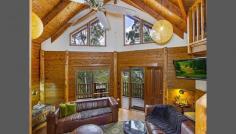  5964 Wisemans Ferry Rd Dharug National Park Gunderman NSW 2775 We believe this wonderful Appalachian Log' home truly has the WOW factor and all the varying lines of the Cathedral Ceilings somehow is inspirational! This home is a Temple' featuring 3 bedrooms (as follows:-) Two large bedrooms downstairs (with built-ins) and a huge mezzanine' Loft that is versatile in as much it could be a wonderful Loft Studio' and huge Master Bedroom or just a huge Loft/Studio, overlooking the living area below from the Balustrade (again what an effect) or just as a Studio! The Kitchen is large, well thought out and of a complimentary design. A huge open plan living/dining area with magnificent views to the Hawkesbury River. This unique hide-away' property is blessed with fabulous River and Bush views, set in its majesty above the World' and yet has an excellent driveway access with ample parking for 3+ Cars and an easy turn-around area. The land area is 986m2 (approx.) of bush-land paradise with this beautiful home perfectly set in its surroundings with the National Park behind. Approx 12kms from Wisemans Ferry overlooking the picturesque Hawkesbury River and roughly only 50mins to Gosford and Hornsby. Rates: $1,045 per year. 