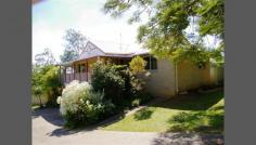  13-15 Ada Cres Upper Caboolture QLD 4510 QUALITY HOME ON 3000m2 IN BOUTIQUE PARK RESIDENTIAL ESTATE (A452) Located on a gentle sloping block with 2 street frontage in a lovely boutique park residential estate is this delightful property ideal for a growing family or a retired couple. The upper level is accessed at street level and features your main living area. There is a spacious open plan living room with high vaulted ceilings.  This has direct access to 2 wide verandahs which wrap around 2 sides of the home.  Here you have a choice of relaxing and entertaining indoors or outdoors with both options offering views of a manicured yard and across to the surrounding countryside and mountains.  The kitchen has similar views. There are three bedrooms all with built in robes, the main has an ensuite. The lower level has a double garage, a study/utility/workshop with telephone line and heaps of storage space. There is three phase power and a built-in compressor will stay. Other great features include: Solar Hot Water. Wood heater in living area. Laundry at upper or lower level. 9m x 6m colorbond shed with power. 2 water tanks. Bush house, orchard including bananas, nut tree and citrus varieties. General Features Property Type: House Bedrooms: 3 Bathrooms: 2 Land Size: 3000 m² (approx) Indoor Features Toilets: 2 Outdoor Features Garage Spaces: 4 