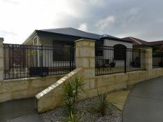  14 Harden Park Trail Carramar WA 6031 HARD WORK DONE! ENJOY THE REWARDS! Lifestyle choices abound in this gorgeous low maintenance 3 bedroom, 2 bathroom home opposite serene nature strip and located between 2 parks. This home is perfect for professional couples, young families or for the discerning older downsizing couple.  Wake up to birds chirping in your stunning master bedroom with feature window, timber blinds, modern and practical ensuite and massive walk in robe. Bed 2 and 3 are double in size with beautiful beech engineered timber flooring, timber blinds and double built in robes. Sensational open plan family, meals and kitchen featuring large split system reverse cycle air conditioning and modern tiling throughout overlook the fantastic outdoors. The well equipped kitchen comes with stainless appliances, wall oven dishwasher and large walk-in pantry. Enjoy a glass of wine while admiring the fully landscape, low maintenance gardens with feature stone clad wall. Throw another prawn on the barbie and never run out of gas with your built in barbecue connected to mains gas. Gorgeous timber deck alfresco is perfect for evening meals or soulful relaxation. Watch sunsets from the privacy and peacefulness of your front timber . General Features Property Type: House Bedrooms: 3 Bathrooms: 2 Land Size: 320 m² (approx) Indoor Features Toilets: 2 Alarm System Air Conditioning Outdoor Features Garage Spaces: 2 Other Features Built-In Wardrobes,Close to Schools,Close to Shops,Close to Transport,Garden 