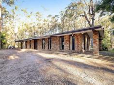  300 Gembrook - Tonimbuk Road Gembrook VIC 3783 Absolute Privacy And Seclusion On 6.6 Acres! Located at the entrance to Bunyip State Park, your privacy and serenity is assured with this 'one of a kind' property. Drive up the long winding concrete driveway to the back of the block where you will find the lovely single level 'ranch' style double brick home-built using handmade 'convict made' bricks believed to be recycled from an old hotel in Sydney. The home is beautifully nestled amongst Australian gums, flora and fauna on a flat and usable plot with scope to put your own 'stamp' on it. Sit and relax on the front patio and watch the extensive bird life, or spot the wallabies and goannas meander by - even koalas have been spotted in the trees from time to time! If peace and quiet is what you are looking for then look no further!  Having only one owner since the 1980's, this home has never been offered for sale so take this opportunity to make it your own! Featuring: * 6.6 acres (2.67Ha) approximately of private land * Well-built unique and solid double brick single level home  * Large living and dining area with high cathedral ceilings * Functional timber kitchen with quality s/s upright stove, double sink & breakfast bar General Features Property Type: House Bedrooms: 2 Bathrooms: 1 Land Size: 2.67ha (6.60 acres) (approx) Outdoor Features Carport Spaces: 1 Garage Spaces: 2 