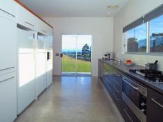 

 Far Meadow 
 NSW 
 2535 
 This prestigious 110 acre rural property is situated between the 
mountains & the sea in the Berry District. Located two hours from 
Sydney, 5 minutes to the pristine 7 Mile Beach and 6 minutes to the 
historic township of Berry makes for an ideal rural escape. 
 On arrival to the property you are greeted by a long leisurely 
driveway, unfolding before you is a picturesque scene of rural 
splendour. Lush cleared farmland presents like parkland with pockets of
 natural timbered forests. 

 In the distance you can see on the hillside, a contemporary designed 
home with amazing ocean, mountain & rural views inviting you to 
visit. 

 The architect designed residence has a sense of resort living yet strong connection to country lifestyle.
 This innovative generously proportioned, split level, three 
pavilions 4 bedroom, 3 bathroom double garaged home, nestles perfectly 
in the terrain & capitalises on the northerly aspect & its high 
profile position, on the land. 
 The home has been designed to capture views from every window or 
sliding door, framing beautiful scenes of lush farmland, ocean and 
mountain range vistas. 
 An open plan living pavilion features low maintenance polished 
concrete floors, floor to ceiling glazing and a centrally located double
 sided fireplace between the lounge and dining areas completes the 
ambience. 
 The kitchen is screened from the dining & lounge area through 
high level joinery unit, and features ample storage space, quality 
Italian stone bench tops, European fitting & fixtures and large 
working space.
 The accommodation pavilion comprises of 4 spacious bedrooms (master 
with ensuite & sitting area), a large streamline bathroom and 
additional guest bathroom. 
 Privately located on the property are, two guest pavilions, both 
self contained with separate bedroom, living and dining storage and 
bathroom with services core to the kitchen.  The owners have been 
operating the popular holiday accommodation for a number of years. NB 
this property is not being sold as a business but adds to your potential
 options in the future.
 The property has a 1klm of road frontage, three large dams, town 
water and is fully fenced into several paddocks with a stockyard. 
 The potential is limitless, for this primary producing land 
including possibilities of vineyard, horse stud or continue as tourist 
accommodation. There is also the potential to increase the tourism 
component on the property, subject to council approval, or just relax 
and enjoy the peace and serenity of this rural escape. 
 