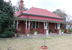  4 Warne Street Wellington NSW 2820 The front section of the house has been beautifully maintained and features  the original, high, decorative  plaster & pressed metal ceilings, picture rails, fireplaces, wide timber windows, brick column pillars with timber fretwork, stained glass, wide doorways, and the traditional archway. The vendor has renovated the two existing bathrooms, each complementing the original era. Three of the  four bedrooms are double sized rooms, whilst the fourth room allows access into one the bathrooms. Three living areas are a bonus with any growing family, one for everyday living, one as  a rumpus/T.V room and of course the elegant formal lounge room with it’s open fire place. 