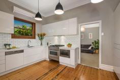  117 Balmain Road Leichhardt NSW 2040 Lifestyle Location, Classic Appeal Beautifully updated yet full of period charm, this freshly presented Federation home delivers an abundance of character, space and convenience for quality city-fringe living. The property's elegant traditional layout boasts two good-sized bedrooms and a bright and airy lounge, stunning eat-in kitchen and separate dining room. A covered rear entertainers' deck and level grassed courtyard promises a blissful indoor-outdoor lifestyle in a desirable position moments to restaurants, parks, schools and fast city transport. - Original features harmonise with modern comforts - Gas heating, ornate plaster ceiling to living room - Ilve 6-burner gas cooking, chunky stone benchtops - Northeast facing rear yard, impressive storage - Wide architraves, ceiling roses, picture rails - Stunning original Baltic Pine floorboards - Master bedroom boasts built-in robe, decorative fireplace - Modern bathroom with frameless shower and tub Land Area: 	 202m2 approx Water Rates: $196 per quarter Council Rates: $344 per quarter Figures are approximate only. 