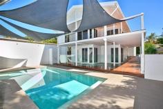  32 Mitchell Street South Mission Beach QLD 4852 Vacation, Vacation, Vacation All successful holiday homes have one thing in common….location, location, location! And you will feel as though you are on R&R as soon as you cross the threshold! This stunning multi-level home will have you unpacking your bags in moments. Constructed over multi levels, this contemporary beach house is bathed in natural light and finished in light and neutral colours to highlight the beautiful Coral Sea and Dunk Island views. The street frontage is deceptive and reveals only the high clearance boat and carports. More is unveiled as you wander up the driveway where an additional 2 boat or car spaces are overshadowed by the fantastic pool area complete with bbq pavilion and bathroom. The home is air conditioned yet natural air flow via louvres and expansive sliding doors to decks and pool areas, will ensure the power bills are low. The central level is dedicated to open plan living, a gourmet kitchen and wide deck where the views are truly tantalising. All this and you are one street back from the beachfront.  Let the pictures tell the story and contact marketing agent Melissa Thurgood for further information and to schedule  General Features Property Type: House Bedrooms: 3 Bathrooms: 3 Land Size: 969 m² (approx) Price per m²: $717 Indoor Features Toilets: 3 Air Conditioning Outdoor Features Garage Spaces: 4 Swimming Pool - Inground Other Features Built-In Wardrobes,Garden,Polished Timber Floor,Terrace/Balcony 