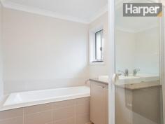  6/7 Fonda Avenue Rutherford NSW 2320 For Sale Offers over $350,000 This as-new contemporary home presents spacious interior living and quality throughout located in an exclusive family-friendly estate just 10 minutes to schools, shops and train station in Maitland town centre, and 45 minutes to Newcastle CBD and beaches. The home’s modern façade combines a full-brick exterior with timber accents and picture windows to build strong street appeal that blends seamlessly into this high-end estate. Enter into a wide tiled hallway that’s bathed in natural light and opens out into the spacious open-plan living/dining room. There are premium floor tiles to the dining area and as-new carpet to the living area that also features a distinctive horizontal picture window that drinks in abundant natural light. The living area opens onto an entertaining patio in the private backyard with a lawn and garden, and the dining area opens to an additional wrap-around verandah. Back inside, the premium designer kitchen adjoins the dining area and features large island breakfast bar, stone bench tops, quality stainless steel appliances including dishwasher, gas cooking and modern glass splashback. The immaculate main bathroom presents a generous glass frame shower, separate bath and modern vanity with stone top and above-bench vanity. The king-sized master bedroom offers a bright and sunny aspect and features a modern ensuite, also with glass frame shower and stone-top vanity. Bedrooms two, three and four are all of generous proportions, and a well-equipped internal laundry and double lock-up garage complete the package. This property features: -- Split-system air conditioning to the main living area  -- Premium floor tiles to kitchen, hallway and dining area  -- As-new carpet to the main living area and bedrooms  -- Quality fixtures and fittings throughout  -- Double lock-up garage with automatic roller door To view this property, please call Harper Property Agents on 1300 626 111 Inspections Sat, 01 Nov 01:00 PM - 01:20 PM Features General Features Property Type: Unit Bedrooms: 4 Bathrooms: 2 Indoor Ensuite: 1 Outdoor Garage Spaces: 2 