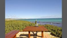 23 De Burgh St Ledge Point WA 6043 ABSOLUTE BEACHFRONT Classic Family Holiday Home on the waterfront at Ledge Point. a pristine holiday destination about an hour's drive North of the Metro Area. Evening alfresco entertaining, relaxing on the ocean front patio viewing the magnificent western sunsets. Walk off the patio direct on to the beach for a refreshing swim/ paddle, launch your own tinny for a spot of fishing. It really does not get any better than this. But wait, there's more. Development potential. Relax now, and develop later. Or just enjoy the remarkable ambience of this warm, true Aussie beach home. This property has been owned by the same family for over 30 years, which says it all. 