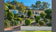  34 N Arm Rd Middle Cove NSW 2068 Waterfront Family Home. First Time Offered In 55 Years Immaculately presented and beautifully maintained family home offered for sale by the original owners. Positioned in a private and secluded setting directly opposite a waterfront reserve and enjoying elevated tranquil views of Sugarloaf Bay with a north/east aspect. Spacious and sunny lounge flows through expansive glass sliding doors to the north facing verandah capturing uninterrupted water and bushland views. Surrounded by immaculate gardens, this wonderful home is footsteps to the water's edge via Harold Reid Reserve and foreshore walk. And only 8 kms to CBD. * Family friendly with single level living * Timber kitchen in excellent condition * Dining flows to family room & separate study * Terraced outdoor entertaining area at rear * Double garage with storage & internal access * In-ground pool with change room facilities * 5 mins drive to Castlecrag & Chatswood * Only 8 kms to CBD 