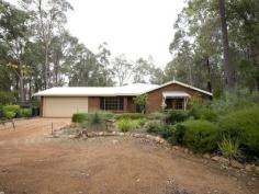  Parkerville WA, 6081 IMMACULATE INSIDE & OUT As you enter this well presented 4 bedroom, 2 bathroom brick family home through the lovely leadlight feature door, you will be impressed by the light and bright atmosphere and the generous nature of the practical floor plan. With formal lounge & formal dining, open plan kitchen / meals / family area and good sized bedrooms. The master bedroom has its own ensuite and walk in robe. Two other bedrooms have built in robes whilst the remaining bedroom has a sizeable robe recess. All bedrooms together with the formal living area are carpeted while the open plan living area has attractive and practical slate floors. With insulation in the ceiling and a slow combustion wood fire you certainly will not feel the cold. And summer is no problem either with the home having ducted reverse cycle air conditioning. A large paved gabled patio is perfect for outdoor entertaining and is accessed from the family area. A double garage under the main roof complete with automatic tilt-a-door is very handy.  Nestled on a lovely, shady and well fenced 1800 sqm block located in a quiet, popular street close to playground reserve. The established gardens are full of color at this time of year. The back yard is very private with natural brush fencing around the perimeter, easy care native gardens and reticulated lawn. Hidden away in a far corner of the block is a garden shed and wood shed Just minutes to shops & school, Mundaring village and within an easy commute to Midland and the airport. Nothing to do here other than unpack and enjoy. 