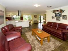 Parkerville WA, 6081 IMMACULATE INSIDE & OUT As you enter this well presented 4 bedroom, 2 bathroom brick family home through the lovely leadlight feature door, you will be impressed by the light and bright atmosphere and the generous nature of the practical floor plan. With formal lounge & formal dining, open plan kitchen / meals / family area and good sized bedrooms. The master bedroom has its own ensuite and walk in robe. Two other bedrooms have built in robes whilst the remaining bedroom has a sizeable robe recess. All bedrooms together with the formal living area are carpeted while the open plan living area has attractive and practical slate floors. With insulation in the ceiling and a slow combustion wood fire you certainly will not feel the cold. And summer is no problem either with the home having ducted reverse cycle air conditioning. A large paved gabled patio is perfect for outdoor entertaining and is accessed from the family area. A double garage under the main roof complete with automatic tilt-a-door is very handy.  Nestled on a lovely, shady and well fenced 1800 sqm block located in a quiet, popular street close to playground reserve. The established gardens are full of color at this time of year. The back yard is very private with natural brush fencing around the perimeter, easy care native gardens and reticulated lawn. Hidden away in a far corner of the block is a garden shed and wood shed Just minutes to shops & school, Mundaring village and within an easy commute to Midland and the airport. Nothing to do here other than unpack and enjoy. 