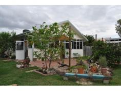  2 Luisa Circuit Mareeba Qld 4880 This lovingly cared for family home is situated in a quiet family friendly neighbourhood and only minutes from Mareeba's CBD. The well maintained, tiled four bedroom home has an open plan living with plenty of natural light. The kitchen is near new with plenty of cupboard and bench space. The oversize laundry doubles as an office with plenty of storage space. Three of the bedrooms have walk-in-robes. There is a sun-room which leads onto the back patio which is perfect for that lazy Sunday afternoon snooze. $325,000 NEG 