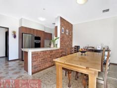  1/2 Gardinia Street Beverly Hills NSW 2209 ENORMOUS BRICK HOME ON 3 LEVELS THE PHOTOS, FLOOR PLAN & DESCRIPTION DO NOT DO THIS PROPERTY JUSTICE - YOUR INSPECTION IS HIGHLY RECOMMENDED TO APPRECIATE THIS TRULY MAGNIFICENT HOME POSSIBLE IN-LAW ACCOMMODATION/GRANNY FLAT 5 LARGE BEDROOMS - 2 KITCHENS - 3 BATHROOMS - OPEN PLAN LOUNGE/DINING AREA - FORMAL LOUNGE ROOM The property is an enormous and extremely well maintained brick home in a very sought after quiet location. There are 3 large bedrooms on the entry level, plus 2 big bedrooms upstairs with built-in wardrobes. There are 3 immaculate bathrooms, one on each level of the house. The main open plan lounge/dining/kitchen area is very spacious with high ceilings and sliding doors that open to a huge verandah (30 sqm Approx.), with a sought after Northerly aspect and very pleasant district views. The kitchen has been tastefully renovated with quality Miele appliances, gas cooking, ducted exhaust, dishwasher, long breakfast bar and plenty of cupboard and bench space. There is a huge granny flat/in-law accommodation on the ground floor with a near new kitchen with gas cooking/ducted exhaust & tastefully renovated bathroom. The granny flat has doors that open to a very large covered entertaining area. The backyard is a good size and low maintenance with a lovely vegetable patch and a sought after & sunny Northerly aspect. There is a wide driveway to a very sheltered double carport with a gate and a door that provides access to the backyard. The property has many sought after features such as a quality built & custom made timber staircase, covered entrance, large entry foyer, wine cellar, lots of extra storage space, ducted air conditioning back to base alarm system, to name a few. VERY RARE OPPORTUNITY TO PURCHASE A VERY SOLID AND SUBSTANTIAL HOME IN THE AREA 
