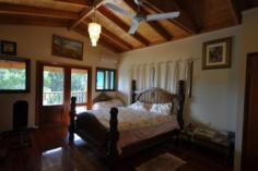  594 Binna Burra Road Beechmont QLD 4211 Picturesque Getaway Located in the mountains of Beechmont is this archtectually designed split level home. Ideal for the whole family, B & B, Holiday Letting etc. Set on 4 acres (16630m2) of ample flora and fauna, ideal privacy. This property boasts: * 5 bedrooms * 3 bathrooms * 4 car garage * 2 carport space * Covered outdoor entertaining area * Inground solar heated swimming pool * Family room on the middle level, for privacy and convenience for the whole family * This home features a warm and inviting feel to it with an abundance of timber used throughout, lets out a country feel to it + combustion fire place * Located only minutes from the local Binna Burra Lodge, approx. 15 minutes from Canungra Township, 30 minutes to Nerang. An inspection will impress. General Features Property Type: House Bedrooms: 5 Bathrooms: 3 Land Size: 1.66ha (4.10 acres) (approx) Indoor Features Ensuite: 1 Toilets: 3 Study Floorboards Broadband Internet Available Built-in Wardrobes Dishwasher Open Fireplace Outdoor Features Secure Parking Carport Spaces: 2 Garage Spaces: 4 Balcony Deck Outdoor Entertaining Area Shed Swimming Pool - Inground Eco Friendly Features Solar Panels Water Tank Greywater System Asking $775,000 