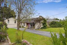  4 Tennent Street, Dromana VIC 3936 Price in Excess of $490,000 Set behind private fencing on a huge allotment approx 1,240m2 you will find this charming brick residence with detached studio over double garage with a very good view of the bay. As you travel down the long sealed driveway you find the main house that offers open plan living and dining with feature timber floor, split air-conditioning and an open fire place. The large bay window floods the house with natural light. The timber floor flows through to kitchen and dining areas. The kitchen features a beaut stainless steel gas stove and dishwasher. There are three double sized bedrooms and a main bathroom with bath, separate shower and toilet. Across the rear of house with the northerly aspect is a most enjoyable timber deck with laser light roofing. This overlooks the rear gardens and lawns. Then the bonus is the second storey studio over the new double garage with auto door. This inspiring space has its own access and a great bay view. Truly a most impressive property and priced to sell. 