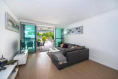  1106/118 Parkside Circuit Hamilton QLD 4007 Courtyard Apartment with River Views in Pet Friendly Building Beautiful 2 bedroom ground floor apartment, near new, is finished using high quality stone benchtops and appliances. The Kitchen includes Miele gas 5 burner cooktop, Miele electric oven and microwave, super quiet Miele dishwasher, built-in Miele coffee machine and space for a large single door refrigerator - the kitchen is designed to cook in. The apartment has rarely been lived and due to a change in the owners' circumstances, is priced for a genuine sale.  The spacious tiled living area opens via sliding doors to a large, private courtyard with areas for quiet contemplation or gathering with friends. A raised benchtop overlooks the parkland and provides magic views to the Brisbane River. Included in the courtyard, is a plumbed in gas, 4 burner, stainless steel BBQ and is completed with a private entry from the exterior walkway, allowing dual entry into the apartment. Main bedroom opens to the courtyard, includes plentiful wardrobe space for two people and an ensuite. The second bedroom includes built in wardrobe and is suitable for home office, children/teenager bedroom or guest room, with easy access to the main bathroom. General Features Property Type: Apartment Bedrooms: 2 Bathrooms: 2 Building Size: 81.00 m² (9 squares) approx Land Size: 142 m² (approx) Indoor Features Ensuite: 1 Toilets: 2 Intercom Gym Broadband Internet Available Built-in Wardrobes Pay TV Access Dishwasher Reverse-cycle Air Conditioning Air Conditioning Outdoor Features Remote Garage Secure Parking Garage Spaces: 1 Courtyard Fully Fenced Swimming Pool - Inground $699,000 