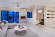  25 Slipstream Road Coomera Waters Qld 4209 Cooler evenings inside with flickering flame for setting the right mood,
 or summer evenings outside with cooling sea breezes overlooking the 
resort style pool. There is also a private Courtyard Retreat for coffee 
& chat and on those occasions when you are at home alone you can 
relax in the most cosy TV Retreat. Privacy is certainly assured, 
resulting from clever planning of timber screens & tree planting. 
All for you to enjoy.....if you are quick to act! 
 
Other features & benefits include:- 
* Summer fun days are assured with resort style pool & screened BBQ area. 
* Separate media room for those special movie evenings at home. 
* Cosy TV Retreat conveniently located to everyday family living area. 
* Private Courtyard Retreat ideal for a relaxing coffee break or reading a book. 
* Up to the minute kitchen with walk-in pantry, glass splashbacks & gas cooktop. 
* Everyday family room has natural flow to large covered alfresco for summer fun days. 
* Most private fully landscaped rear yard is ideal for children & family pets to play in safety. 
* Spacious main bedroom boasts glamorous en-suite, walk-in robe & courtyard retreat. 
* Remaining three bedrooms have easy access to family bathroom. 
* Separate study with feature timber & glass doors, ideal for home office. 
* Air-conditioning with ceiling fans & natural sea breezes provide year round comfort 
* Mobile 24/7security provide peace of mind whether at home or away. 
