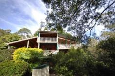  594 Binna Burra Road Beechmont QLD 4211 Picturesque Getaway Located in the mountains of Beechmont is this archtectually designed split level home. Ideal for the whole family, B & B, Holiday Letting etc. Set on 4 acres (16630m2) of ample flora and fauna, ideal privacy. This property boasts: * 5 bedrooms * 3 bathrooms * 4 car garage * 2 carport space * Covered outdoor entertaining area * Inground solar heated swimming pool * Family room on the middle level, for privacy and convenience for the whole family * This home features a warm and inviting feel to it with an abundance of timber used throughout, lets out a country feel to it + combustion fire place * Located only minutes from the local Binna Burra Lodge, approx. 15 minutes from Canungra Township, 30 minutes to Nerang. An inspection will impress. General Features Property Type: House Bedrooms: 5 Bathrooms: 3 Land Size: 1.66ha (4.10 acres) (approx) Indoor Features Ensuite: 1 Toilets: 3 Study Floorboards Broadband Internet Available Built-in Wardrobes Dishwasher Open Fireplace Outdoor Features Secure Parking Carport Spaces: 2 Garage Spaces: 4 Balcony Deck Outdoor Entertaining Area Shed Swimming Pool - Inground Eco Friendly Features Solar Panels Water Tank Greywater System Asking $775,000 