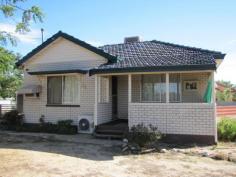  12 Morton St Merredin WA 6415 REDUCED!!! Clad (face) brick & tile cosy home on a large (1100 square meter) corner block. The lounge room features a split system air conditioner and leads onto the small front porch. A good sized kitchen with heaps of cupboard space and gas oven and stove. Three reasonable sized bedrooms and a neat bathroom with shower over the bath tub. Single carport and small garden shed in rear yard plus a small patio area of the laundry. Currently leased for $240 per week (12 months lease) fully furnished, this property makes a good rental investment property. Easy maintenance yards with minimal gardens and rear yard undeveloped so you can set it up however you would like. Contact our office on 9574 2917 and speak to Tiffany or Tony for further information on this property or to arrange an appointment to view the property. 