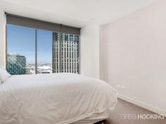  1912/1 Freshwater Place Southbank VIC 3006 Luxury corner apartment with 19th floor city backdrop - approx 92sqm Perched on the banks of the Yarra River in a prestigious resort style address, this flawless corner apartment embodies a sophisticated open gallery design with impressive proportions, exemplary finishes and floor-to-ceiling windows throughout.  Captivating city views wraparound the spacious living and dining areas to create a supreme entertainers’ retreat of sheer opulence. An exquisite marble island kitchen serves as a grand space with stainless steel gas appliances and superior fittings. Residents enjoy access to a range of facilities on level 10 including a gymnasium, pool, spa, sauna, steam room, massage rooms and rooftop garden selection of barbecue amenities with a spectacular view.  There are two generous bedrooms with built-in wardrobes, including the master retreat complete with walk through wardrobe and ultra-stylish ensuite. Additional highlights include a crisp white marble finished bathroom, ducted air conditioning, chic downlights, video intercom, concealed laundry facilities, secure car space and lift access. It presents a solid investment opportunity with high rental returns, or an impressive option for those seeking a prized lifestyle of supreme ... show more View Sold Properties for this Location View Auction Results General Features Property Type: Apartment Bedrooms: 2 Bathrooms: 2 Indoor Features Toilets: 2 Air Conditioning Outdoor Features Garage Spaces: 1 Swimming Pool - Inground Other Features Built-In Wardrobes,Close to Schools,Close to Shops,Close to Transport,Secure Parking Offers over $750,000 