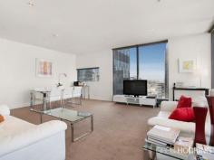  1912/1 Freshwater Place Southbank VIC 3006 Luxury corner apartment with 19th floor city backdrop - approx 92sqm Perched on the banks of the Yarra River in a prestigious resort style address, this flawless corner apartment embodies a sophisticated open gallery design with impressive proportions, exemplary finishes and floor-to-ceiling windows throughout.  Captivating city views wraparound the spacious living and dining areas to create a supreme entertainers’ retreat of sheer opulence. An exquisite marble island kitchen serves as a grand space with stainless steel gas appliances and superior fittings. Residents enjoy access to a range of facilities on level 10 including a gymnasium, pool, spa, sauna, steam room, massage rooms and rooftop garden selection of barbecue amenities with a spectacular view.  There are two generous bedrooms with built-in wardrobes, including the master retreat complete with walk through wardrobe and ultra-stylish ensuite. Additional highlights include a crisp white marble finished bathroom, ducted air conditioning, chic downlights, video intercom, concealed laundry facilities, secure car space and lift access. It presents a solid investment opportunity with high rental returns, or an impressive option for those seeking a prized lifestyle of supreme ... show more View Sold Properties for this Location View Auction Results General Features Property Type: Apartment Bedrooms: 2 Bathrooms: 2 Indoor Features Toilets: 2 Air Conditioning Outdoor Features Garage Spaces: 1 Swimming Pool - Inground Other Features Built-In Wardrobes,Close to Schools,Close to Shops,Close to Transport,Secure Parking Offers over $750,000 