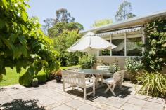  14 Bradman Avenue, Bowral NSW 2576 If you’ve strolled along Cherry Tree Walk and wandered up this lovely avenue to Bradman Oval, the chances are you have spotted a gorgeous little cottage behind the distinctive post and rail fence with a glorious Atlantic Cedar Tree.  For many years, its delightful secrets have been tightly held by one owner, but now the magic of Claire de Lune is revealed. As its name suggests, it is enchanting in the moonlight, but the garden is so lush and private, that even on the busiest day, it is quiet, peaceful and a true haven.   A perfect down-sizer or weekender but with plenty of space in which to extend, it is right on a beautiful walking path that winds through Old Bowral and comes with a garden that is quintessential ‘country’. Claire de Lune is nestled at the end of a perfect little avenue and offers: Double brick cottage with rear weatherboard extension Central hydronic heating, plus gas log fire and a/c in rear living Insulated, warm & cosy North to rear combined living/dining room with large picture windows Sunny paved rear courtyard capturing northerly aspect 3 double bedrooms, 2 with BIR and lovely garden views 2 nd large living area with large alcove and views to garden Pretty panelled windows, traditional cottage charm Large, private garden with birch grove, old climbing roses, persimmon tree, Golden Elm, Blue Spruce, parterre hedging and spring and autumnal specimen plants Short stroll to Bradman Oval, Bowral Hospital, Bowral Town Centre 