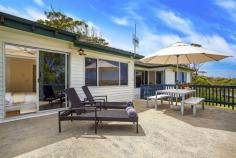  47 Vista Avenue North Copacabana, NSW 2251 Nestled in the dress circle locale of Vista North Avenue looking towards
 the Pacific, this quintessential beach house will suit either a coastal
 family wanting to get their foot in the door to buy a view or an 
investor who sees the prime opportunity of such useable land with 
outlook. 
– Panoramic ocean and valley views capture Copacabana, MacMasters Beach and Sydneys coastline to North Head 
– Unique corner block with easy access- useable 550sqm of land 
– Flat front and rear yards for hours of enjoyment for the children to run around in 
– Large open plan living room with sunken lounge area basking in the views 
– Open plan kitchen and dining 
– Three bedrooms all with built in robes 
– Timber floors, air conditioning, Foxtel 
– Family bathroom with separate WC 
– Single remote lock up garage & storage, extra parking for multiple cars 
– Easy to maintain gardens, undercover entertaining to the rear 
– The large entertaining deck is where you will spend time creating 
endless memories, enjoying ocean vistas by day and spectacular pink 
sunsets by night, including Sydney New Years fireworks 