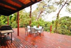  40 Johns Crescent, Mount Evelyn, VIC 3796   $420,000 Plus On Approx Three Quarter Acre There is no other like it! Built with a mix of recycled 100 year old bricks, stone from the site and weatherboards, pieces of an old shearing shed, lead light windows and rough hewn timbers. Timber kitchen overlooks the big deck that sits amongst the greenery for privacy and pretty treed outlook. Open plan lounge with split level to formal dining and a lovely curved staircase to the mezzanine master bedroom and ensuite. Downstairs is a further two bedrooms, with both being double in size and one opening out onto the deck. Large picture windows make the most of the lovely treed outlook, with great out door entertaining on a large deck, overlooking the big, big back yard nicely. (approx 3,000 metre block) The emphasis is on a tranquil lifestyle If you are looking for something very special, and are ready for a renovation project, this home says welcome. 