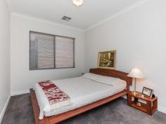  39 Runnymede Gate Wellard WA 6170 A TOUCH OF CLASS! Need 4 bedrooms for a growing family? This new to the market beautifully located home has 4 double bedrooms, all with Robes PLUS a Study/Activity Room! This large family home exudes a quiet elegance that starts at the glass featured front door and continues right through the home. The neutrally tiled flooring also starts at the front door, carries through to the open plan living areas and all traffic areas. In fact, the whole house is decorated in quiet, neutral tones that allow you to add your colour and style. There is a separate Lounge or Quiet room to the left of the wide inviting entrance hall with the Master Bedroom to the right. Plenty of room here for your King Sized bedroom suite, also a spacious Ensuite Bathroom with a separate WC. Lots of Open Plan Living overlooked by a well equipped Galley Style Kitchen with Stainless Steel gas cook top, rangehood, oven and double sink. Kitchen also boasts lots of cupboards, overheads and a walk in pantry. Ducted Reverse Cycle Air Conditioning ensures comfortable living all year round. The feeling in this quality constructed home is Spacious, Light, Bright, Airy and Classy! On a 509sqm block with a smart bordered lawn, double driveway to double remote controlled automatic door at the front of the home and a shrub bordered lawned area at the back, overlooked by an Alfresco Entertaining area, there is plenty of room for both the kids and the adults to play!! Public Transport to the door, a short walk to the Wellard Train Station, the new Shopping Precinct and Peter Carnley make this a very attractive proposition. A Terrific Location!! Take a long look at this property - it is a lot of house with a lot of benefits. There are times when only the best will do - Buying a home is one of these!! 