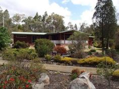  66 Dalcouth Road Stanthorpe Qld 4380 3 BEDROOM, 2 BATHROOM HOME ON JUST UNDER AN ACRE 
							Bordered by lovely gardens and lawns is this charming 3 bedroom 
western red cedar home, less than 5 mins from town on just under an 
acre. Featuring an open plan living design with the lovely pine kitchen 
overlooking the lounge and dining areas, this home also boasts three 
built-in bedrooms, WIR off the master, two bathrooms, a well positioned 
enclosed sunroom and a large front verandah overlooking the gardens and 
pond. Also boasting wood heating plus reverse cycle air conditioning, a 
6m x 9m single remote lock-up garage with plenty of storage/workshop 
space, 9,400 gallons of rainwater and a covered barbeque area, this 
property represents true value for money and an inspection is highly 
recommended. Contact Scott Mann on 0427 814 444 or Simon Leigh on 0418 
790 070 to arrange an inspection.