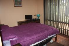  3-13 Battarbee St Araluen NT 0870 End unit in a small complex of only three, in an "all private" location. Body Corp fees shared so are very reasonable. This light bright solid and spacious unit has additional garden space and garage converted to study/additional living area. Both bedrooms are queen sized with built in robes. And there is a generous amount of additional storage in the wide passage. The bathroom has walk in shower, and full bath and vanity, with a convenient separate toilet. The large open plan living and dining areas are adjacent to the well equipped kitchen. The bench and storage space are generous and the convenient electric cook top is complimented with a wall oven and grill. Sliding door access allows for easy all weather outdoor entertaining in the neat paved and private patio. The garden is low maintenance and paved for child and pet security. The property may be sold furnished if required. (Furniture negotiable) 