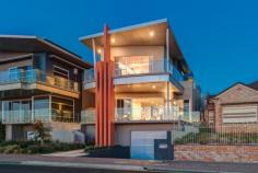  160 Esplanade Brighton SA 5048 Perfectly positioned on Adelaide's best coastal strip and moments from the beach, offering luxury and lifestyle at its very best. Sited on desirable, and manageable allotment of 563sqm approx and built by Tanti Constructions, this exceptional Esplanade entertainer was built using the highest quality materials and unsurpassed craftsmanship which sublimely emphasises a blend of rustic and contemporary themes including a lift servicing all 3 levels… An outstanding example of a grand and edgy contemporary build. The expansive open plan living areas on the ground floor comprise of 3 sections which can be independently segregated through stylish sliding glass partitions, the front being formal living/dining and balcony with some of the most stunning views you'll ever see in a beach side home. The middle section comprises an expensive kitchen with a gorgeous dark Antique Brown granite benchtops, appliances by Miele including; induction cooktop, steamer, oven, warming draw, and an abundance of storage in the 2 pac cabinetry. There is also a large power room, spacious pantry, separate laundry with outdoor access, informal dining, and breakfast bar seating. The rear section is used primarily as a TV room or retreat, and also have a small study nook. Upstairs there is a total of 5 bedrooms and three bathrooms, the master with Balcony, ensuite and double walk in robe, bedroom two also has an ensuite with built in robe, and bedroom five at the rear with east facing balcony and built in robe.  