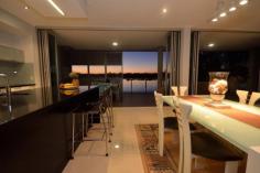  25/20 Anchorage Circuit, Twin Waters, QLD, 4564 Architecturally outstanding waterfront townhouse imbued with superior form * Expansive long water views framed by striking lines and clever spatial transitions * Arguably the finest position within this highly sought after private enclave * Designed with dramatic flair to push the visual boundaries across waters edge * Unrepressed 4 metre deep private timber decking partners multipurpose privacy shutters * Vast banks of stacker doors peel back to integrate interior and exterior living spaces * Culinary designer kitchen blends sleek ebony benches and walls of custom white cabinetry * 3 Carparks individually garaged in secure basement carpark, along with an exclusive caged storage area * Opulent master suite with private viewing platform and decadent spa tub perched at waters edge * Dedicated media room/third bedroom accesses private courtyard terrace * Separate wing houses office and massive bedroom with balcony, dressing room and ensuite * Includes private and unique wet edge lap pool in addition to the larger central pool in the complex * CBUS technology throughout, two private garages and a large storage cage accessed via elevator * Moments to Twin Waters Golf, or the ambient cafe's and unspoilt surfing beaches at Mudjimba $1,150,000 