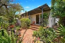  30 Birt Avenue, Budds Beach, Surfers Paradise QLD 4217 Own a Piece of Paradise! Budds Beach Villa $549,000 Located in the highly sought after inner Surfers Paradise riverside enclave of Budds Beach is this extremely rare opportunity to secure a 2 bedroom, 2 bathroom single level villa. The unique offering would be perfect for investors or owner occupiers being well sized throughout and perfectly positioned metres from the river, cafes, and the Surfers Paradise CBD.  The villa is all on one level and features a large private North facing terrace that leads from the living and dining areas. The kitchen is open plan and well-appointed and both bedrooms are well sized, the main featuring an ensuite.  - Private North facing terrace with water glimpses  - Large living and dining areas  - Two generously-sized bedrooms both with mirrored built-ins wardrobes  - Two renovated bathrooms, including separate oversize shower and bath - Master bedroom featuring a large ensuite as well as a walk-in wardrobe  - Open plan kitchen with plenty of bench space featuring a new dishwasher - Separate laundry, single lock up garage + off street car space - Security screens and new awnings, loads of storage - Newly installed reverse-cycled air conditioner as well as fans throughout Perfectly positioned at the river end of Budds Beach, metres to family-friendly parks and beaches, the popular Bumbles café and the new lightrail, this spectacular villa offers the ultimate in private central Surfers Paradise living and is a must to inspect as it is priced for a quick sale. 