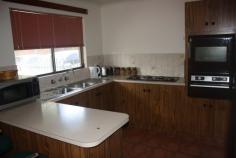  3-13 Battarbee St Araluen NT 0870 End unit in a small complex of only three, in an "all private" location. Body Corp fees shared so are very reasonable. This light bright solid and spacious unit has additional garden space and garage converted to study/additional living area. Both bedrooms are queen sized with built in robes. And there is a generous amount of additional storage in the wide passage. The bathroom has walk in shower, and full bath and vanity, with a convenient separate toilet. The large open plan living and dining areas are adjacent to the well equipped kitchen. The bench and storage space are generous and the convenient electric cook top is complimented with a wall oven and grill. Sliding door access allows for easy all weather outdoor entertaining in the neat paved and private patio. The garden is low maintenance and paved for child and pet security. The property may be sold furnished if required. (Furniture negotiable) 