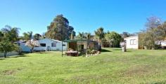  Gidgegannup WA, 6083 NOT YOUR AVERAGE 5 ACRE PROPERTY Interesting and versatile this 5 acre property on the western side of Roland Road is just ten minutes to Midland and five to the Roe Highway. Previously operating as a woodyard, the property has a number of potential uses under its current zoning.  The 3 x 1 home is airconditioned, spacious (222m2 under main roof) with an extra WC, generous living areas and lots of shady spots to sit outside. It is attractively decorated and set amongst lush tropical gardens which are irrigated from the large dam. One of the bedrooms has been converted to an office with its own separate entrance. A games room with bar leads out to a covered barbecue area a real man's cave for those who love entertaining! It has a serviceable workshop with extra lean to section plus big open fronted farm shed and various smaller outbuildings. Not to mention the huge American Barn style shed which has been set up as an entertainment venue complete with bar and stage bring on the Karaoke! There are also two bores (only one of which is currently plumbed) with good quality water and a smaller spring fed dam with its own tiny jetty. The land is soft and suitable for horses or ponies and there are a number of aviaries which would remain on site for the bird lover. This is an interesting and unique property set right at the gateway to Gidgegannup and inspection will not disappoint. 