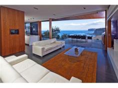  32 The Serpentine Bilgola NSW 2107 SHEER BEACHFRONT LUXURY Created by CABE, one of Australia’s preeminent development companies and winner of 31 industry awards, this is the ultimate seaside retreat for the cutting-edge Connoisseur.  Apart from the breathtaking Oceanfront location and spectacular views across the Pacific Ocean and pristine coastline, the attention to detail and high quality fit-out, is nothing short of stunning.  No expense has been spared in its creation, from the level street access with elevator to all floors, to the automated doors revealing a view-swept infinity pool and magnificent oceanfront lawn.  Accommodation comprises 5 bedrooms, 4½ bathrooms, extensive living and entertaining areas, separate Home Office, thermo-controlled Wine Cellar, media room, gourmet kitchen and enormous storage areas.  A rare offering in such a prized position, this luxury property is one that has definitely raised the bar for excellence in this country. *** BE SURE TO VIEW OUR AMAZING 2min VIDEO TOUR ONLINE AT maxwalls.com/id141 