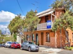18 Ennis St Balmain NSW 2041 Presented over two levels this spacious terrace offers charm and elegance. An attractive exposed brickwork facade with sandstone trim makes for an appealing exterior. Interiors are arranged in a traditional floor plan showcasing high ceilings, timber floors and original fireplaces. A separate formal lounge is partially separated from an adjoining dining room. Multiple windows and skylights throughout the home assure bright interiors. Also discover a separate polished granite kitchen with stainless steel appliances and a courtyard garden embraced by mature greenery. Upstairs find two generous bedrooms with timber doors accessing a private balcony. This promising lifestyle home is situated in a corner position an easy walk to the delights of Darling Street and within several minutes drive to Sydney CBD. • Corner position within trio of chic terraces • Minutes walk to Darling St, celebrated village lifestyle • Well-presented with opportunity for further development • Period style features, lounge, adjoining dining • Timber floors, down lighting, 2 fireplaces • Granite kitchen and concealed wine cellar • Rear courtyard encircled by greenery • Potential for off street parking (STCA) • Two generous bedrooms on upper floor, main with balcony • Linen storage, concealed laundry, main bathroom • Set on a corner position occupying 135sqm of land