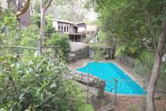  62-64 Fowler Road Illawong NSW 2234 A standout Peninsula Opportunity 
						Offered for the very first time this sensational land parcel of 
2034m2 is ideal for redevelopment, potential subdivision or a new 
prestige property with room for a tennis court, swimming pool and ample 
parking. Offering water views of the Georges River to the north and 
backing on to Thompson's Bay reserve & the Woronora River to the 
south it boasts a 25.3m street frontage and level grounds. The existing 
home is a classic 50's design complete with sweeping staircase entry, 3 
bedrooms, a Tasmanian Oak kitchen and one of the best pool room & 
bars you could wish for. Out buildings include a garage & workshop 
plus a storage shed and there is oodles of parking for boats, trailers 
& vans. Contact Manson Property now on 9543 7355 or Andrew on 0418 
168 525 or Lene on 0411 7000 14 to arrange your viewing.   
					 