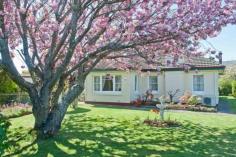  97 Emu Bay Rd Deloraine TAS 7304 Deloraine Gem Nestled into a large 991m2 corner block you will find this gem of a house. Rendered and with tiled roof, this home has three generous bedrooms with built-ins, spacious lounge-room, plus open-plan kitchen and dining area. Both wood heating and two reverse-cycle air conditioners for heating/cooling provides indoor comfort. Outdoors, a rare sheltered back garden is a lovely sun trap in winter months. Vehicle garaging from two separate streets is available as well as plentiful workshop and storage space. Attractive gardens compliment the house beautifully. Close to public transport, shops, and town services, this property is perfectly positioned, with views of distant mountain scenery a huge bonus. 