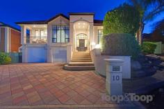  10 Aaron Ave Darlington SA 5047 For Sale $1,190,000 - $1,300,000 This Medallion built home has been built to impress.From the imposing entrance to the high ceiling sitting room, the properties proportions will suit the large family and those who love to entertain. A magnificent gas and solar heated outdoor pool and 16 person spa dominates the rear garden with a huge separate covered entertaining area on the eastern side. A drive through double garage allows access for another 2 car garage which has its own WC and will delight those who need a work place or extra garaging. Two living areas both with solid timber floors and plenty of space will satisfy family requirements. With quality fittings throughout, a luxury kitchen with German appliances and a dining area which will accommodate a large dining table, entertaining will be a pleasure. A huge master bedroom with walk in robe and en-suite with spa epitomises indulgent luxury. 