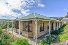  113 Old Willunga Hill Road Willunga SA 5172 A LIFESTYLE INVESTMENT A unique home designed and built by the current owners stands nestled into the Old Willunga Hill escarpment and offers approximately 2 acres of predominately steep fully fenced land boasting a breathtaking rural vista across the Willunga/McLaren Vale vineyards to Gulf St Vincent and beyond. The home which is of generous proportions is surrounded by essentially flat land and offers plenty of off-street parking for pleasure and work vehicles, boat and/or caravan. Comprising a tiled entry with an adjacent home office/study, formal lounge and dining rooms with feature bay windows. A large open plan family room with stunning 'bow window' to capture the amazing panoramic views of the historic township of Willunga and the rolling plains below also incorporates a well appointed kitchen which features timber bench tops and mini orb cabinetry, 900mm gas hot place, underbench oven, built-in-dishwasher and large walk-in-pantry. The family room area also boasts a 'state of the art' entertainment system.  The main bedroom features a bay window, large walk-in robe and ensuite bathroom, bedrooms 2,3 & 4 also have access to fitted built-in-robes. The family or guest bathroom . General Features Property Type: House Bedrooms: 4 Bathrooms: 2 Indoor Features Toilets: 2 Outdoor Features Garage Spaces: 4 Other Features Built-In Wardrobes,Formal Lounge,Separate Dining $649,000-$699,000 