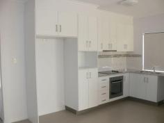  Unit 1 & 2 21 WICKHAM Street Ayr Qld 4807 Very impressive with lots of extras. Approximately 120m2 open plan two bedroom units, both with ensuite, spacious kitchen floor to ceiling storage, quality fittings, modern appliances, chrome brushed lights and fans in living areas, fully air-conditioned, high ceilings, carpet in bedrooms tiled living areas, conveniently located laundry, large back veranda, front patio, fully fences back yard. 