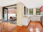  51 Francis St Leichhardt NSW 2040 Generous proportions and bright natural light, define this 
well-designed, freestanding residence situated in a wide, tree-lined 
street moments from Norton Street village and Leichhardt North Light 
Rail station. Spanning two levels, the house has large bedrooms, two 
living areas, alfresco entertainment zones, solar hot water and direct 
access from a secure garage 
 
Large living and dining areas with a seamless flow to a timber decked 
alfresco dining/BBQ courtyard and sunny landscaped garden with level 
lawn 
 
Spacious CaesarStone kitchen with live 5 burner gas range, stainless 
steel range hood, Bosch dishwasher, glass splash backs and pretty garden
 outlook 
 
Sitting room with bespoke cabinetry and library shelving, excellent 
design features include ceiling shadow lines and glass louvres for 
cross-flow ventilation 
 
Downstairs bathroom with frameless glass shower and Caesarstone vanity 
 
Big separate laundry with storage cupboards; another storage area under the stairs 
 
King-size master bedroom has big built-in wardrobe (with pull-down 
double hanging rails), sleek ensuite and balcony overlooking the back 
garden 
 
Two more double bedrooms, both with built-in robes, one with a balcony; 
4th bedroom or study with built-ins, cabinetry, shelves and skylight 
 
Upstairs bathroom features floor-to-ceiling tiles, deep bath and 
separate shower; upstairs hallway with custom-designed cabinet and 
uplighting 
 
Design features include bespoke curtains, pendant lights, custom 
cabinetry, quality carpet, polished hardwood timber floors and glass 
louvres 
 