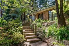  419 Mt. Dandenong Tourist Road SASSAFRAS Vic 3787 $560,000Plus Nestled in this premier Sassafras locale surrounded by landmark properties, this well maintained home with stunning gardens enjoys the benefits of a 'build quality' from a 'by-gone era' and the very best of relaxing living options. The residence skilfully blends classic brick & timber features with a time tested floor plan highlighted by the sunken lounge, separate dining and cosy family room off the well-appointed kitchen. This elevated position assists with maximising with natural light whilst remaining private from the prying eyes of neighbours. With 4 bedrooms, (main with walk in robe & ensuite) every family member gets a room for themselves. Extras include the sweeping driveway to the carport/garage (could also be a teenagers retreat), open fire/solid fuel & ducted heating, mature gardens and a location that allows you to simply walk in to Sassafras to enjoy a coffee & cake combination from one of the several cafes that tourists travel long distances to enjoy! This is a well-loved home ready to be enjoyed by the next lucky owners! 