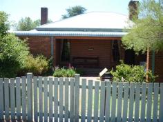  1 Church Street Blayney NSW 2799 $350,000 Property type: House Suburb: Blayney (profile) Region: Regional NSW Land area: 910 sqm  CHARM & ELEGANCE Solid double brick home tastefully renovated in Federation Style situated on 910sqm corner block. Walking distance to schools and sporting facilities and all town amenities. There are 3 large bedrooms, 1 with beautiful wooden built-ins. A formal sitting room with open fireplace and an office/library tempting an extra bedroom space. Charming wooden kitchen opening onto the dining/lounge room perfect for entertaining with choice of romantic pot belly stove or instant gas heating. Renovated bathroom retains original cast iron clawfoot bath with a stain glass window feature. A lovely family style yard, fully fenced with established gardens and double carport.  This home is perfectly presented and is a must see for those seeking comfort and convenience. Features Bath Broadband internet access Built in wardrobes Dishwasher Fireplace(s) Fully fenced Garden / Courtyard Gas Heating Internal Laundry Separate Dining Room 2010953280 