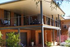  13 Pearson St Guyra NSW 2365 $540,000 Nothing to do but enjoy House - Property ID: 755418 If you're looking for a unique home set out on a one acre block then this magnificent home is for you. Superbly built to the highest standards with outstanding low-maintenance gardens, including a raised vegetable garden. The main level includes: open plan kitchen and living area opening on to a large timber deck with outstanding views. The formal lounge and dining area opens onto a sunny courtyard.  The main bedroom includes: a walk-in wardrobe and large ensuite. Bedrooms 2 and 3 have generous built-ins with a large family bathroom. The lower level would be perfect for a granny flat or guest quarters and includes bedroom, living area, bathroom and even has its own access. Other features include: Double garage, reverse cycle ducted and zoned air conditioning.  